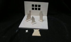 a model of a house with a window and a door.