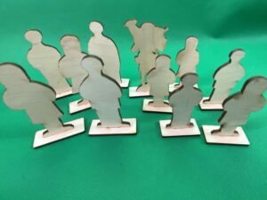 a group of wooden cutouts of people.
