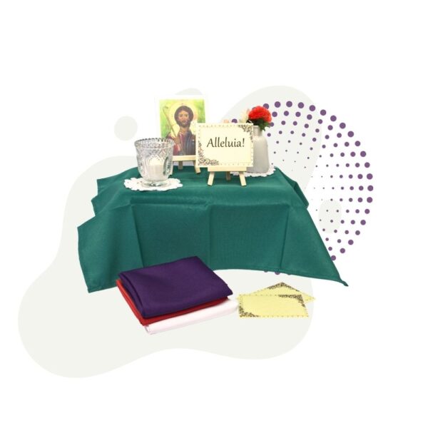 A Prayer Table Set topped with a green table cloth and pictures.