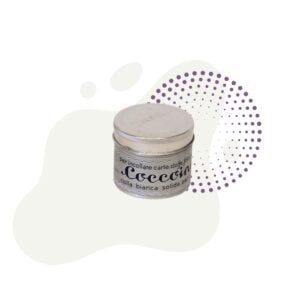 A metal container of Coccoina paste sitting on top of a white background.