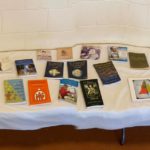 a table with a bunch of books on it.