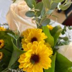 a bouquet of sunflowers in a vase on a table.