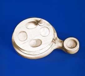 A wooden spoon on a blue surface.