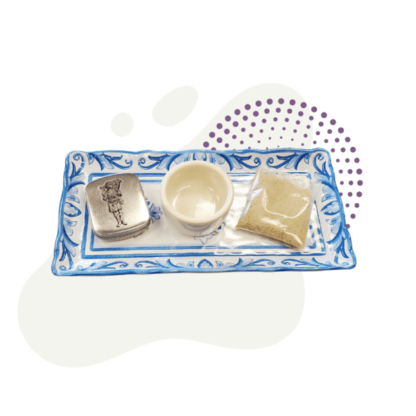 A blue and white tray with a small dish on it.