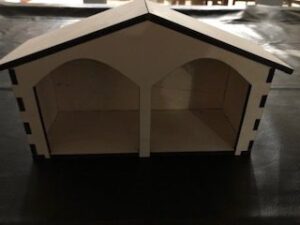 A paper house with two doors and a roof.